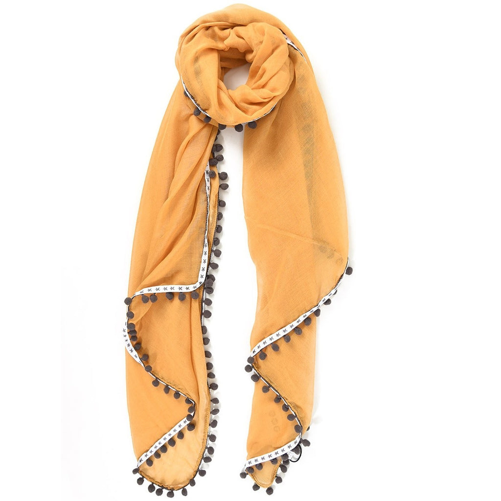 mustard scarf with grey star trim and pompoms
